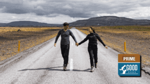 Couple holding hands on a road